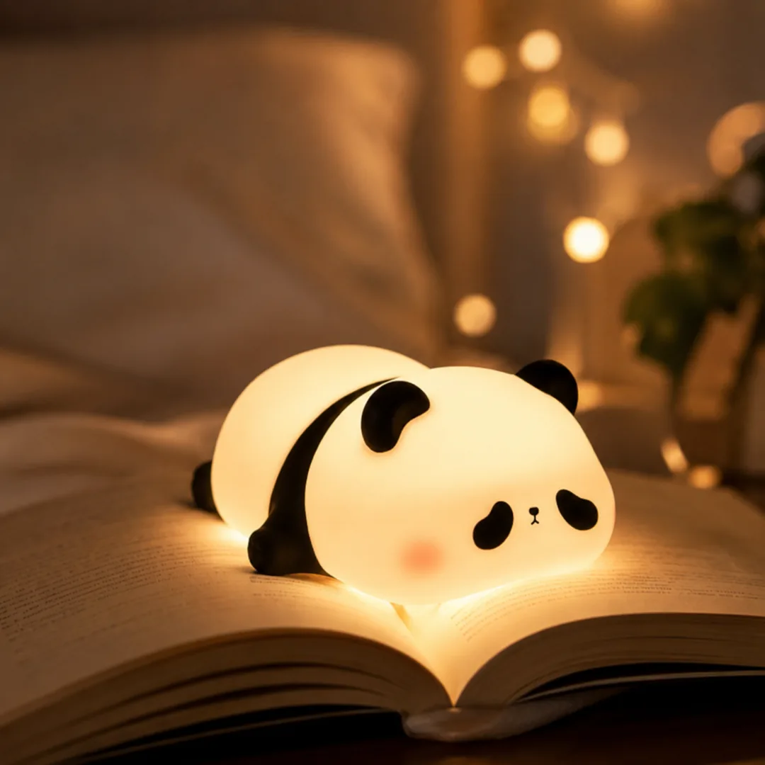 Cute panda silicone night lamp glowing warm on a bed – ZenteMart Pakistan - View 2